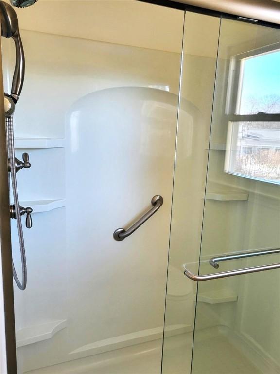 bathroom with a stall shower