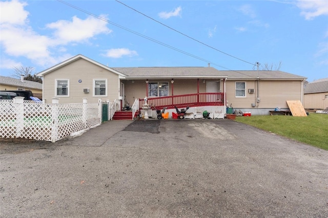 view of front of house featuring a porch and fence