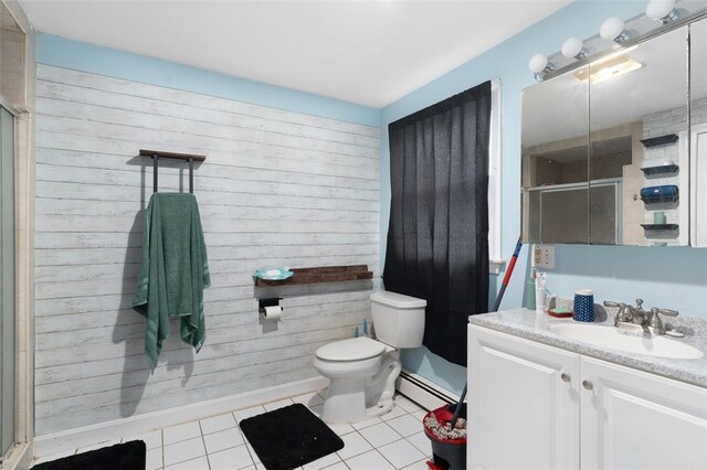 full bathroom featuring a stall shower, a baseboard radiator, toilet, and tile patterned floors