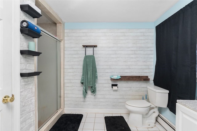 full bathroom featuring tile patterned flooring, toilet, a baseboard heating unit, wood walls, and a stall shower