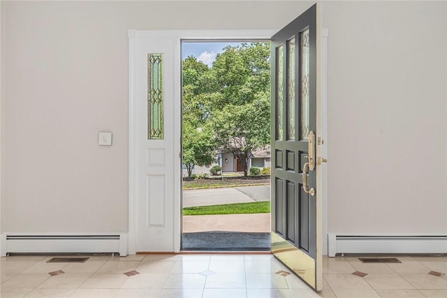 entryway featuring a baseboard radiator and light tile patterned floors