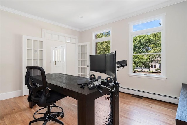 home office featuring a baseboard radiator, baseboards, crown molding, and light wood finished floors