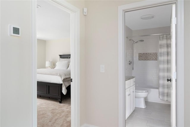 bathroom with vanity, shower / tub combo, ensuite bath, and toilet