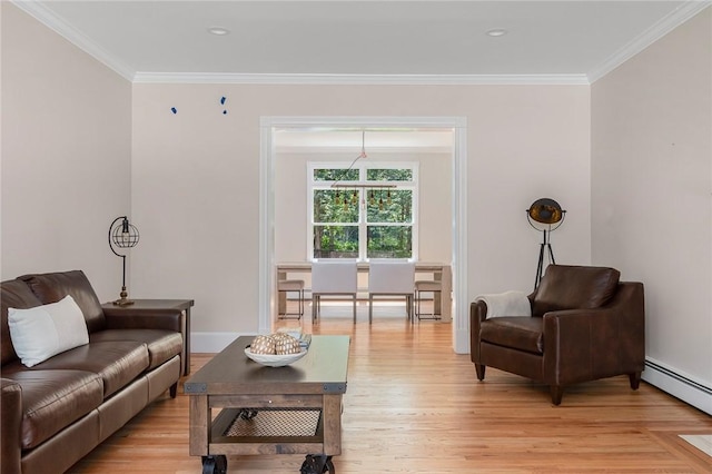 living area with a baseboard radiator, crown molding, light wood-style flooring, and baseboards