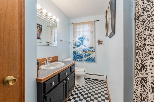 full bathroom featuring toilet, baseboard heating, vanity, and tile patterned floors