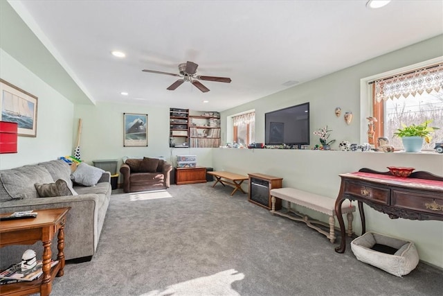 living area with carpet, a ceiling fan, and recessed lighting