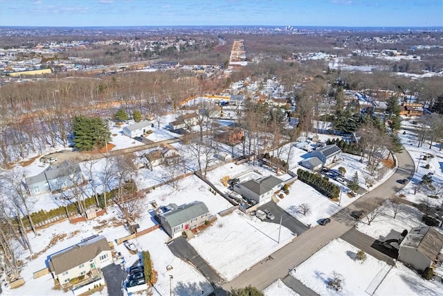 snowy aerial view featuring a residential view