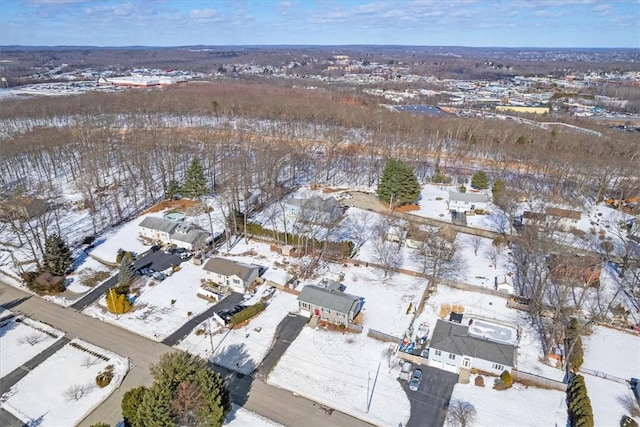 snowy aerial view featuring a residential view