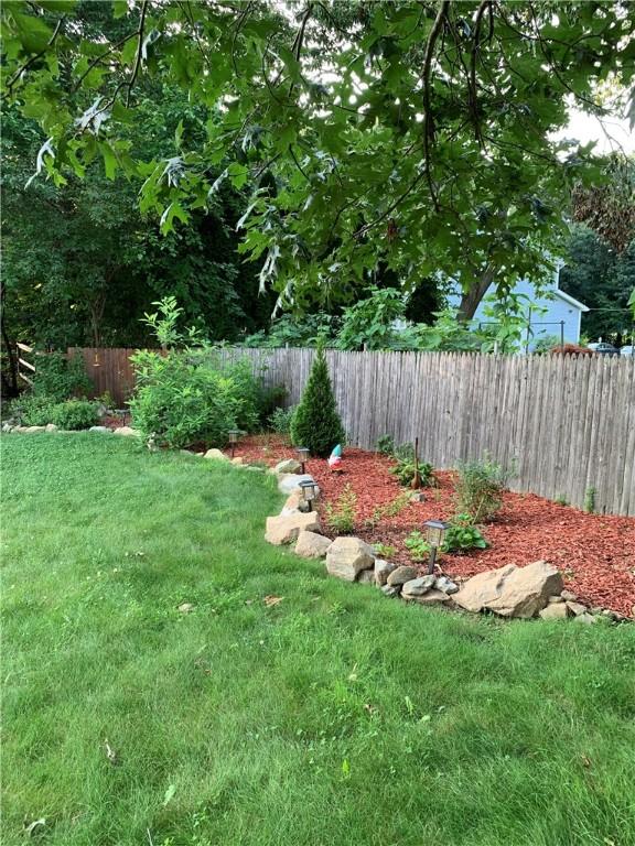 view of yard with a fenced backyard