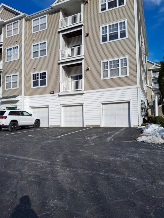 view of property with driveway and an attached garage