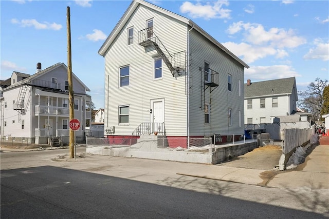 view of front of property featuring fence