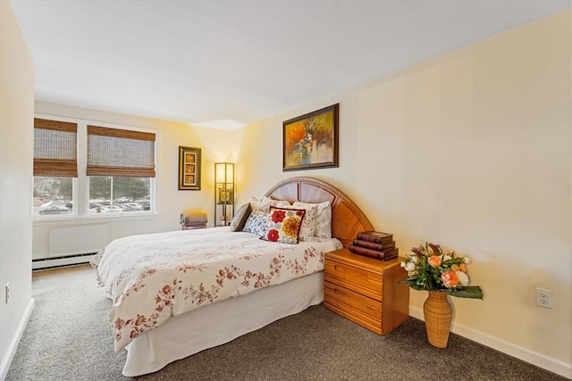 carpeted bedroom featuring baseboard heating and baseboards