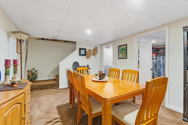 dining room featuring recessed lighting, light carpet, stairway, and baseboards