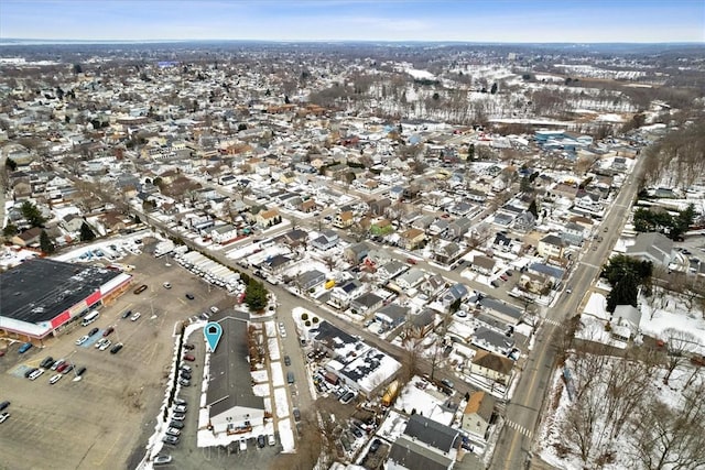 snowy aerial view with a residential view