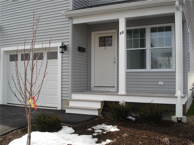 doorway to property featuring a garage