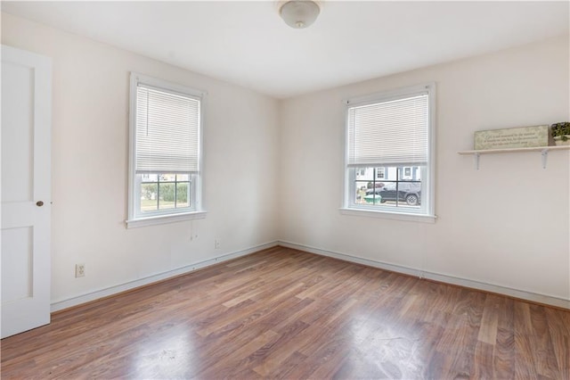 empty room with wood finished floors