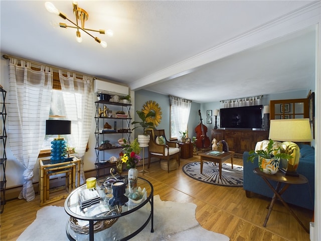 living area featuring wood finished floors and a wall mounted AC