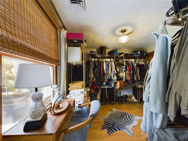 walk in closet featuring light wood finished floors and visible vents