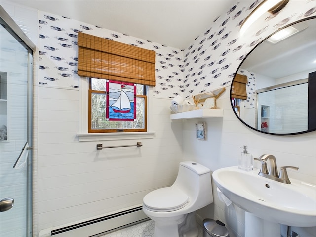 bathroom with a stall shower, wallpapered walls, toilet, baseboard heating, and a sink