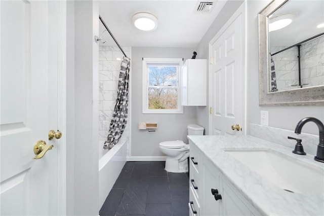 bathroom with toilet, vanity, baseboards, tile patterned floors, and shower / bath combo with shower curtain