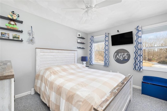 bedroom with carpet, a ceiling fan, and baseboards