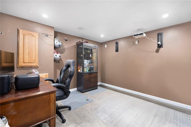 office space with recessed lighting and baseboards