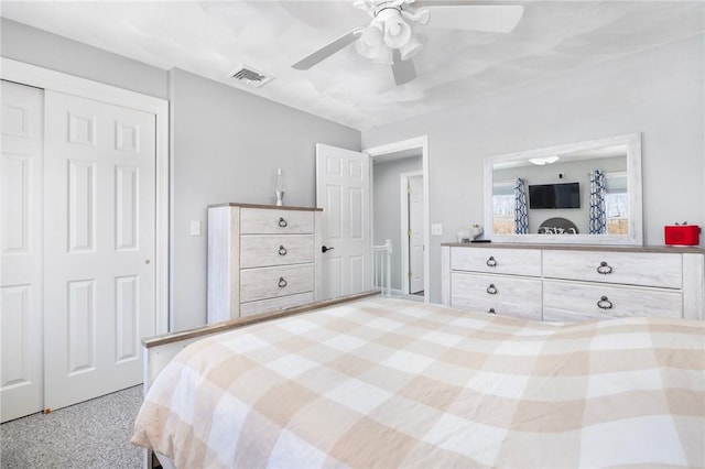 bedroom featuring ceiling fan, visible vents, and a closet