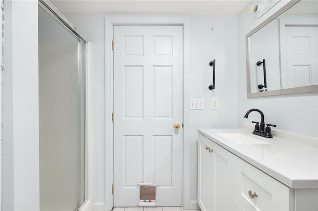 full bath with vanity and a shower with shower door