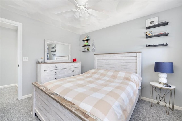 carpeted bedroom with a ceiling fan and baseboards