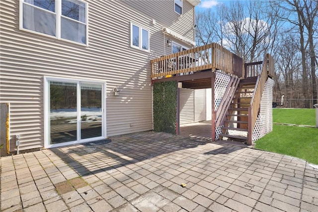 view of patio / terrace with a deck and stairs