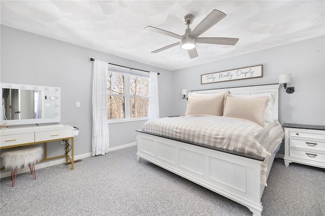 carpeted bedroom featuring ceiling fan and baseboards