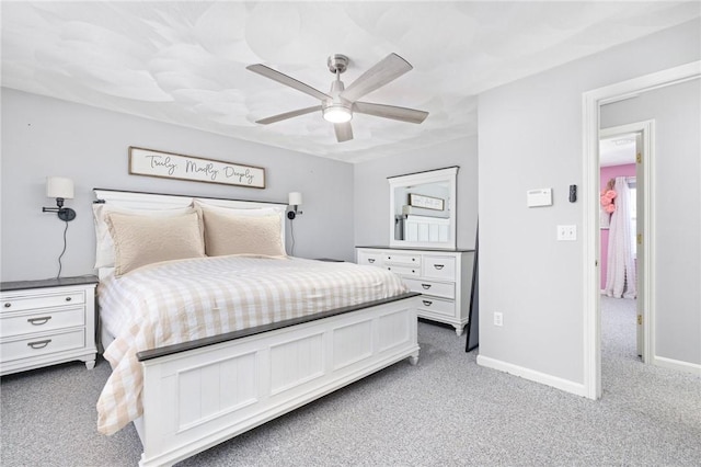 bedroom with carpet floors, ceiling fan, and baseboards