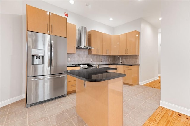 kitchen with a center island, stainless steel refrigerator with ice dispenser, dark countertops, backsplash, and wall chimney exhaust hood