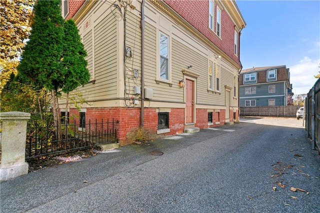 view of side of property with fence