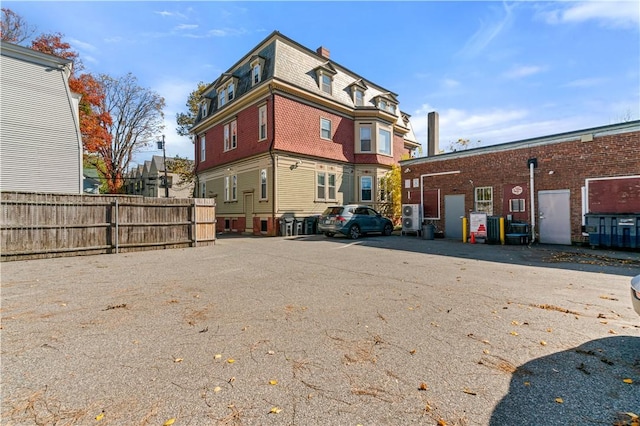 view of property with fence