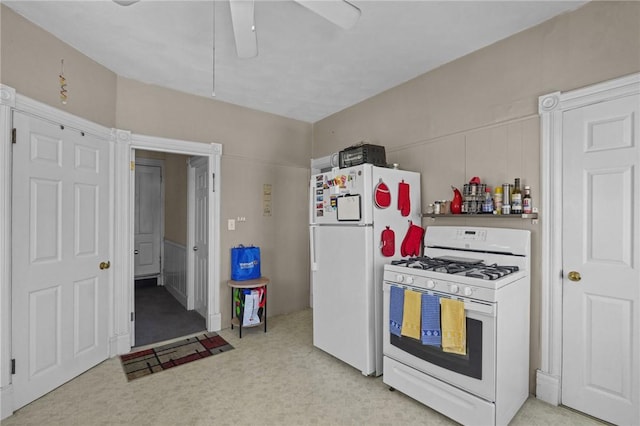 kitchen featuring white appliances and ceiling fan