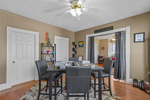 dining space featuring ceiling fan and wood finished floors