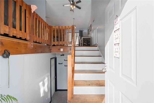 staircase with ceiling fan