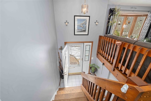 stairs with tile patterned flooring