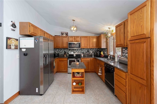 kitchen featuring appliances with stainless steel finishes, brown cabinetry, and a center island