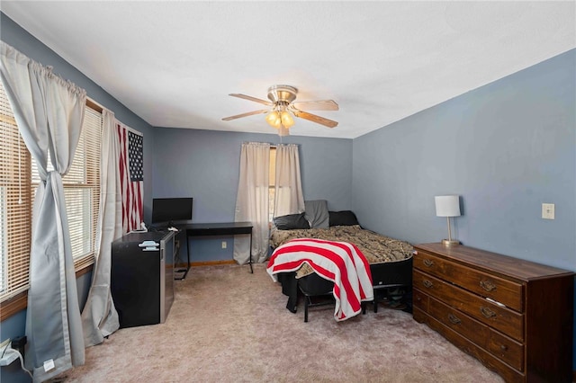 bedroom featuring ceiling fan and light colored carpet