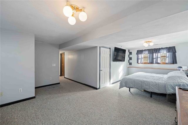 bedroom with light colored carpet and baseboards