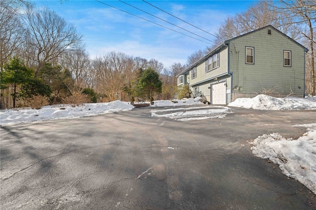 exterior space with a garage