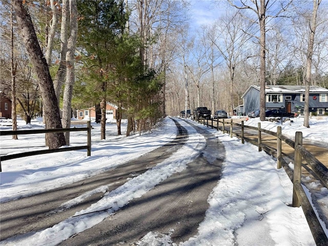 view of street with aphalt driveway