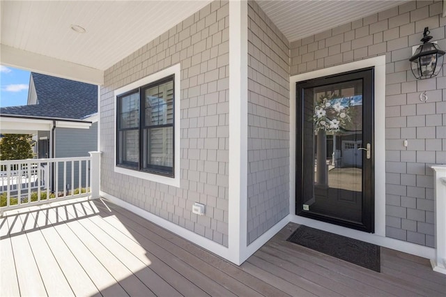 doorway to property featuring a porch