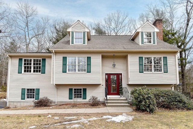 split foyer home featuring a chimney