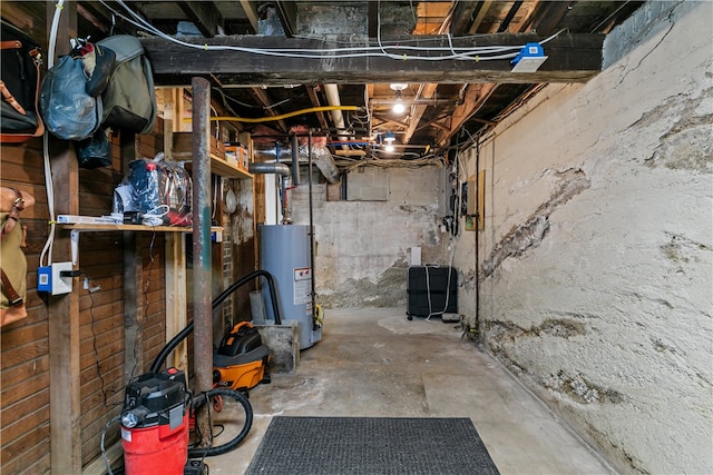 unfinished below grade area featuring water heater