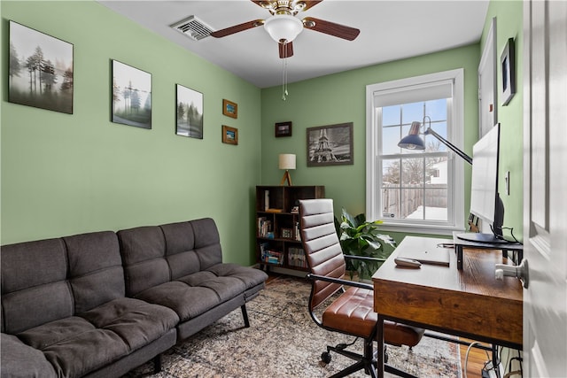 office space with ceiling fan and visible vents