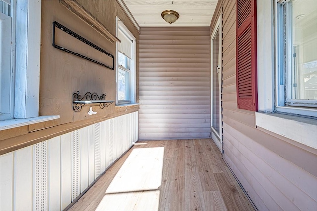 unfurnished sunroom with wooden ceiling