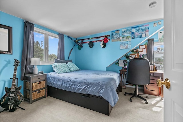 bedroom featuring light colored carpet